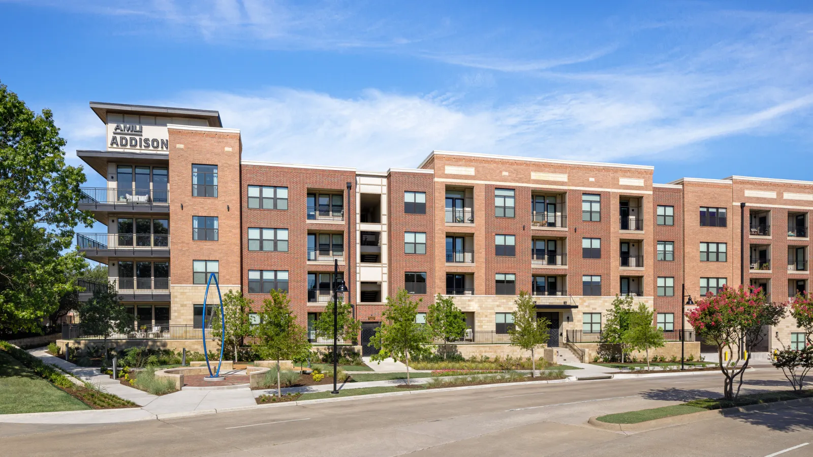 AMLI Addison in Addison: the brick building seen from the street
