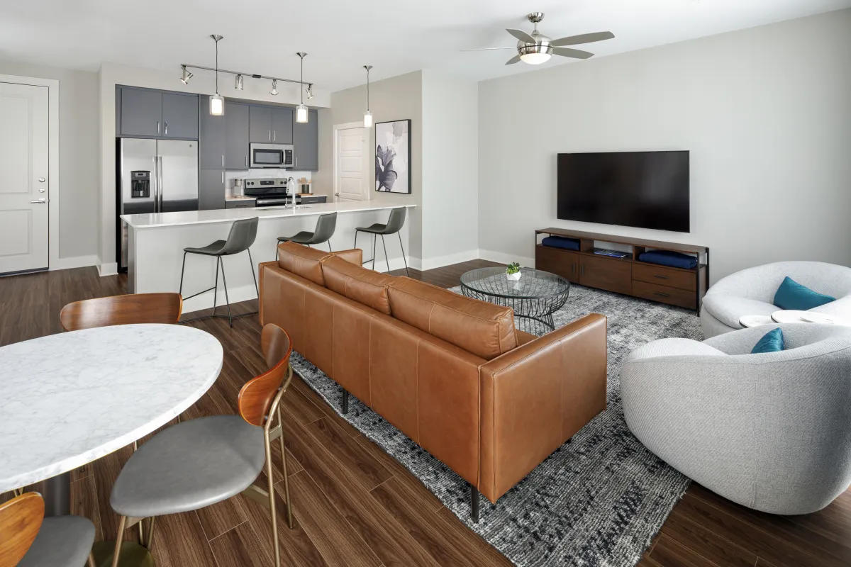 AMLI Addison in Addison: a living room open to the kitchen island