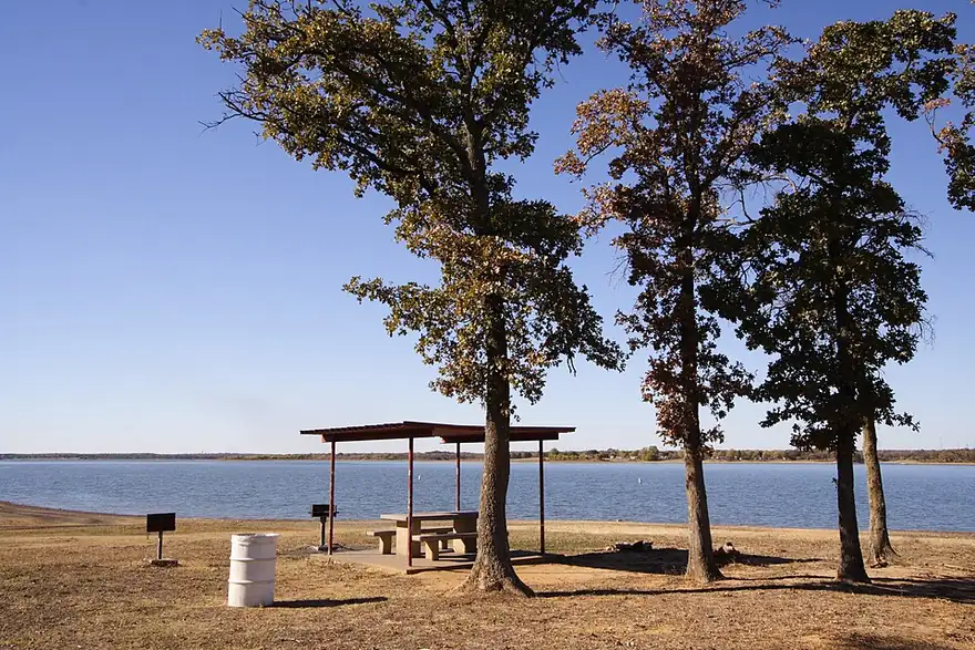 A park with picnic shelters on the shore of Lewisville Lake